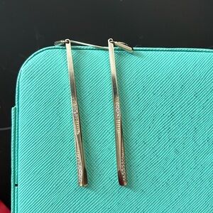 Kendra Scott gold earrings with rhinestones detail